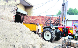A tractor-trailer being used for commercial purpose despite a ban at Lakkar Mandi in Patiala on Sunday. 