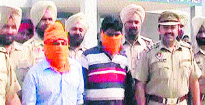 Sukhjinder Singh and Jeewan Singh in police custody in Amritsar on Monday. 