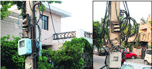 Live wires hang loosely outside a house; and (left) wires on an electricity pole remain uncovered in Sector 10, Panchkula. 