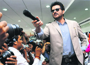 Actor Anil Kapoor interacts with winners of a contest at a car dealership in Mohali on Monday.