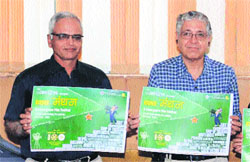 Prof Arun Grover (right), VC, Panjab University, releases the poster of the film festival at his office on Monday.