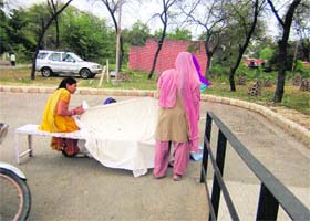 Suman delivers a baby outside the Community Health Centre at Bhuna in Fatehabad on Monday