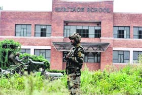 Army personnel keep vigil outside a school in Jammu on Monday