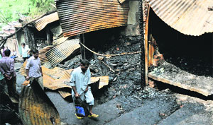 Some of the shops that were gutted in a fire at the Gumat market in Jammu in the wee hours on Monday.