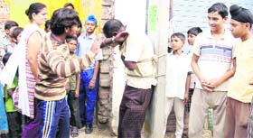 Residents thrash a thief after tying him to an electricity pole at Raj Nagar in Jalandhar on Monday.