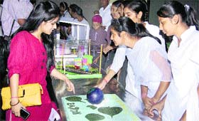 Students show their science model during Ozone Day celebrations at Science City in Kapurthala on Monday.