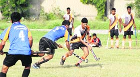 Government school students participate in a hockey match during school games in Jalandhar on Monday.