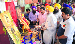District Yojana Board chairman Heera Singh Gabria at the birth anniversary celebrations of Pandit Shardha Ram Phillauri at the Durga Mata Mandir. 