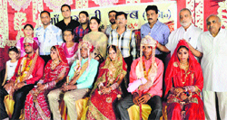 Newly married couples at a mass marriage conducted by Maa Bhagwati Club, Dandi Swami Chowk in Ludhiana on Monday. 