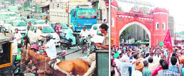 A view of the traffic jam at Bhandari Bridge; and (right) MC employees protest outside the Hall Gate in Amritsar on Tuesday