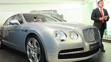 Chris Buxton, Regional Manager India, South Africa and Middle-East, Bentley Motors, poses with Flying Spur at its launch in New Delhi on Tuesday. The car is priced at Rs 3.10 crore (ex-showroom Delhi).