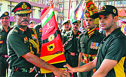 The team leader returns the expedition axe to Lt Gen Philip Campose on culmination of the expedition at Chandimander Military Station in Panchkula on Tuesday