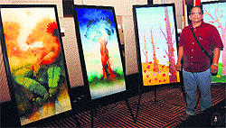 Prashant Sarkar with his works displayed at a hotel in Chandigarh on Tuesday