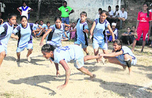 Girls of government schools participate in a kabaddi match during schools games in Jalandhar on Tuesday. 