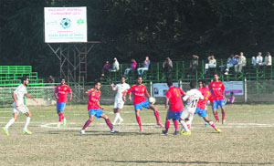 Players in action during the Knockout Football Tournament, organised by the State Bank of India, in Srinagar.