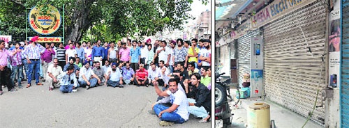 Shopkeepers of Mata Rani Chowk hold a protest against the Ludhiana Municipal Corporation; and (right) shops lie closed in Ludhiana on Tuesday.