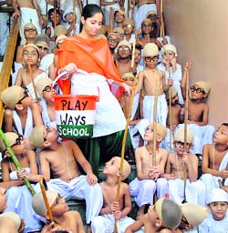 Children dress up as Mahatma Gandhi during a function on the eve of Gandhi Jayanti in Patiala on Tuesday.