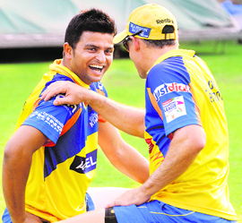 Raina of CSK with a teammate during practice on the eve of their match against T&T.