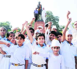 Schoolchildren pay tributes to Mahatma Gandhi on his 144th birth anniversary in Amritsar on Wednesday.