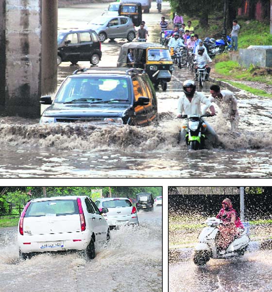 Going gets tough: Vehicles make way through an inundated road at Industrial Area, Phase I, Chandigarh; and residents face a tough time commuting on flooded roads in Chandigarh on Wednesday