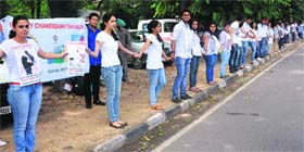 For a cause: Members of various community service organisations form a human chain on National Voluntary Blood Donation Day in Chandigarh