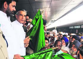 MP Pawan Kumar Bansal flags off the Amritsar-Lalkuan train from the Chandigarh railway station on Wednesday