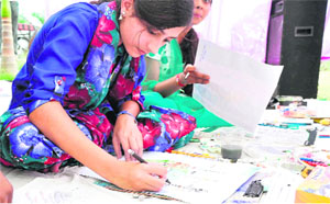 A girl takes part in a drawing competition in Haridwar on Wednesday.