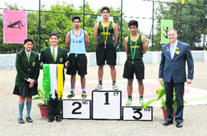 Chief guest Dr Jonathon Long (extreme right) gives away medals to the winners during the 123rd inter-house athletics meet in Mussoorie on Wednesday.
