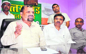 Uttarakhand Kranti Dal chief Trivendra Singh Pawar addresses the media in Haridwar on Wednesday. 