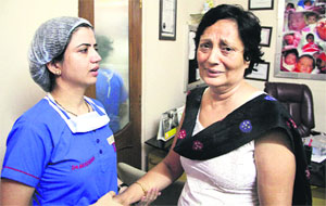 Rashis mother being comforted by a doctor, Archana Daver, at Vardaan Hospital in Jalandhar on Wednesday. Photo: Sarabjit Singh