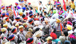 Police cane-charges the protesting Asha and mid-day meal workers in Jalandhar on Wednesday