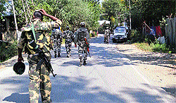 Security personnel carry out a search operation in Gobbal village in south Kashmirs Kulgam district on Wednesday morning