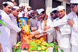 Members of the Congress Seva Dal celebrate Gandhi Jayanti at Dogra Hall in Jammu on Wednesday