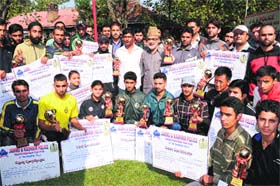 Minister for Rural Development Ali Mohammad Sagar poses with the winners of the marathon