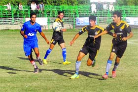 Kick off: Players of SRTC and Maharaja Sports Club in action during a football match in Srinagar on Wednesday. SRTC won the match 1-0