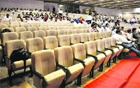 Empty chairs during a training camp organised by the MC at Guru Nanak Bhawan in Ludhiana on Wednesday; and (below) Mayor Harcharan Singh Gohalwaria files his property tax returns. Tribune Photos: Himanshu Mahajan