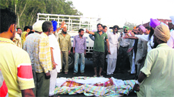 Protesters block traffic on a national highway near Doraha on Wednesday. A tribune Photograph