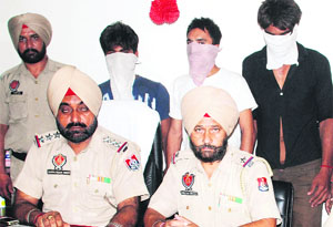 The police with three of the accused arrested with narcotic substances in Amritsar on Thursday. 