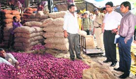 Officials of the UT Administration at the Sector 26 vegetable market.