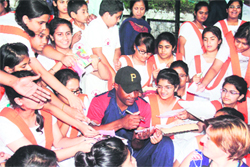 He signs authographs for his fans in Dehradun on Thursday.