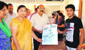 Chief guest Dr Suman Saini (front row, second from left) gives away a prize to a student during a function at Markanda National College, Shahabad-Markanda.