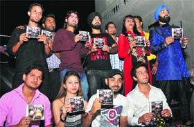 Cast and crew of Damini-the victim' release the music album of the film during a function in Jammu on Thursday