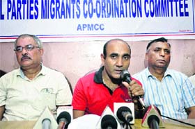 Members of the All Parties Migrants Coordination Committee address mediapersons in Jammu on Thursday