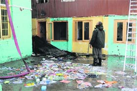 Heaps of books lie on the school campus after the blaze