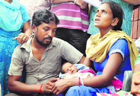 The couple, Sushita and Sandeep, with the baby girl at the Civil Hospital during a protest