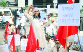 A worker raises slogans during a CPI rally in Ludhiana on Thursday