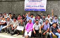 Students hold a demonstration near the Secretariat to press their demands in Dehradun on Friday