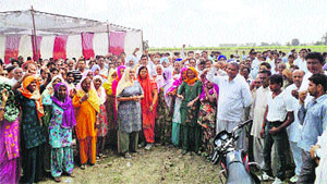 Residents protest near Umri village in Kurukshetra district on Friday. 
