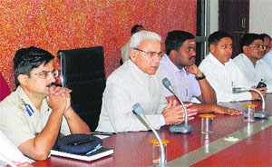 Lokayukta Justice (retd) Pritam Pal (second from left) flanked by Deputy Commissioner J Ganesan and Senior Superintendent of Police Saurabh Singh at Panchayat Bhawan in Sirsa on Friday.