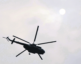 An Army chopper hovers over Jammu city a day before the Navratra festival amid high tension at the LoC on Friday. 